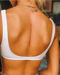 Small Tattoos For Girls On Instagram Can You Figure It Out What S Written On Her Back Tattoos Small Girl Tattoos Dainty Tattoos