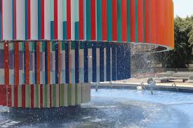 Here, gravel covers a walkway leading to a fire feature, acting as a filter for rainwater to percolate back into the soil. Tel Aviv Dizengoff Fountain Colorful Places Colorful Architecture Tel Aviv