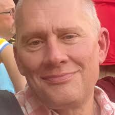 This is a photo of Jamal Zook “Samuel” Cooke (Freddie's nephew) in his home  with a picture of Freddie in the background. He said “Growing up it all  felt quite normal because