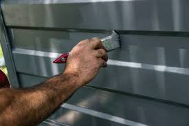 Interesting how the legs are painted on the ground. How To Paint A Garage Door In 8 Steps Mymove