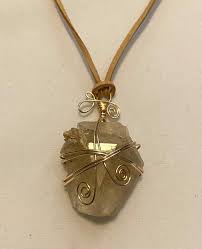 Wire Wrapped Beryl Crystal Necklace On A Leather Cord Etsy Crystal Jewelry Design Crystal Necklace Wire Wrapping Crystals