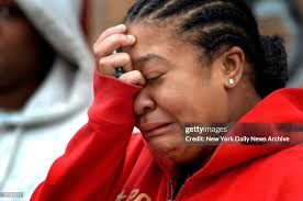 Toya Green, the sister of 21-year-old Darryl Green, weeps at the... News  Photo