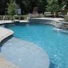 Alec from landplus told me that the pool bottom it is a white pebblesheen, a my sister's pool, photographed in the shade of the morning, has a medium gray plaster bottom. 1
