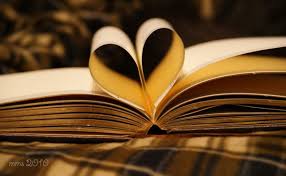 two pages in a book folded to make a heart