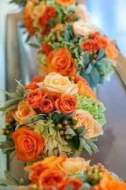 Wedding flowers are one of the most important parts of your wedding, both in terms of style and overall budget. Real Weddings Inspiration Boards Orange Wedding Flowers Flower Decorations Project Wedding