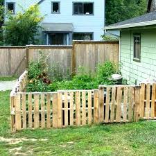 Traditional picket fence creating the perfect dog fence for a garden to help contain the dog whilst the owners were out. Diy Dog Fence Ideas And Installation Tips 6 Best Cheap Designs