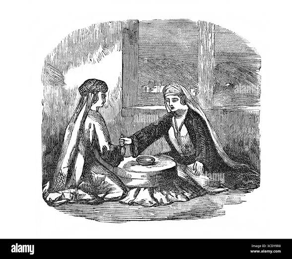 Two women grinding flour in Black and White Stock Photos & Images - Alamy