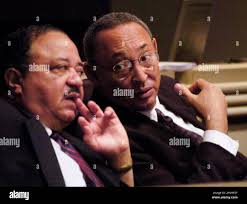 Rep. Alvin Holmes, left, D-Montgomery and Thad McClammy, D-Montgomery,  confer in Montgomery, Ala.