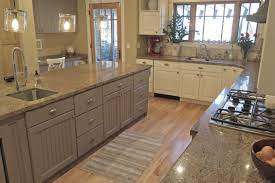 Our kitchen designers can help! White Kitchen Cabinets With Grey Island And Granite Countertops Allen Brothers Cabinet Painting