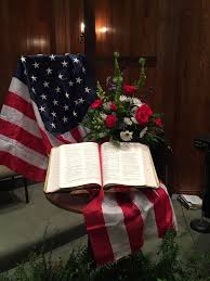Powerfully Simple Patriotic Display With A Bible Flag And Flowers Church Altar Decorations Church Christmas Decorations Memorial Day Decorations