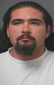 Murder suspect surrenders