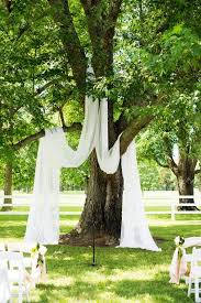 Wooden wedding arches oak tree wedding wedding arch flowers wedding arch rustic wooden arch outside wedding ceremonies wedding ceremony arch wedding ceremony decorations wedding ideas. 27 Beautiful Living Tree Wedding Backdrops And Arches Weddingomania