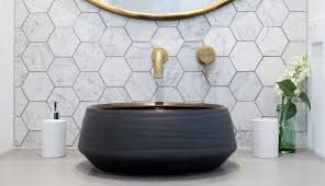 The black hexagon tiles in this grayscale bathroom from studio mcgee are not for the faint of heart, but they are the perfect anchor for a classy and sophisticated space with white subway tile covering the lower walls. Quirky Bathroom Tile Ideas Refresh Renovations