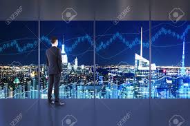 Trade And Investment Concept Businessman In Interior With Night
