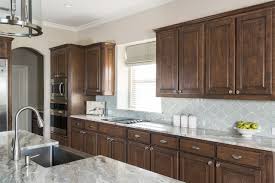 Dark wood cabinetry and island match with same material dark. Modern Kitchen Backsplash For Brown Cabinets Novocom Top