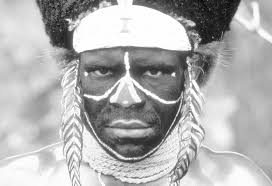 Bantu Tribesman Uses IBM Global Uplink Network Modem to Crush Nut