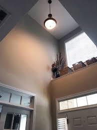 To change light fixture in 2 story foyer. Bold Modern Chandeliers For Two Story Foyers