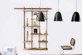 The Entire System Hangs From A Master Wall Mounted Bracket The Shelves Join Together With A Precise Interlocking Sys Shelving Design Shelving Modular Shelving