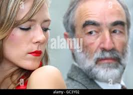 Posing at the Metropolitan Police headquarters, New Scotland Yard, London, 