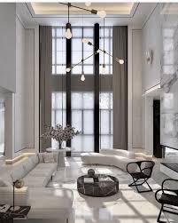 Floating two sofas around a coffee table creates a framework, says lewis. Pinterest In 2021 High Ceiling Living Room Black And White Living Room Luxury Living Room