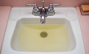 Woman coming out from water in swimming pool. Residents Report Brown And Discolored Water From City Taps Tiger Newspaper
