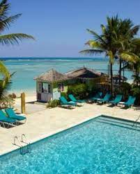 Coyaba Beach Resort Montego Bay Jamaica Although The Beach Is On The Small Side The Large Pool Is Dotted With Comfy Lo Beach Resorts Montego Bay Resort