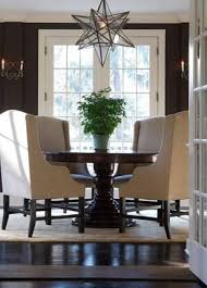Wingback Chairs At The Dining Table Brown Dining Room Elegant Dining Room Home