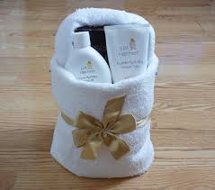 A hand towel fan with pearls attached looks wonderful. How To Make A Basket With Towel Origami Lovetoknow