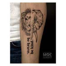 'elephant and lion with motivational quote' tattoo meaning: Vegan Ink Tattoo Studio Il Gatto La Volpe Lucerne The Vegan World Traveller Elephant Tattoos Ink Tattoo Vegan Tattoo