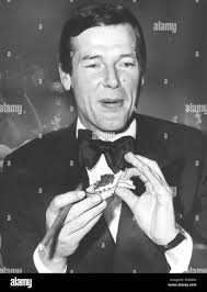 Sir roger george moore hi-res stock photography and images