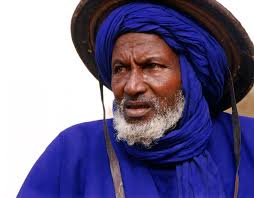 The Niger River snakes from its origin in Guinea, through Mali to Niger,  and on. Old wooden pinasses and pirogue boats continue to carry cargo along  the monotonous, wide ribbon of water.