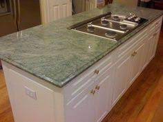 Costa esmeralda granite has an excellent peacock green granite kitchen countertops design ideas combined with backsplash and cabinets. 7 Green Granite Countertops Ideas Green Granite Countertops Green Granite Countertops