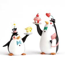 Each one wears a black bowtie. Disney World Of Miss Mindy Penguin Waiters From Mary Poppins
