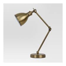 With adjustable focus, this black and brass task lamp is the perfect desk companion whether completing a homework assignment or perusing the newspaper. This Threshold Industrial Task Table Lamp Brass Is Perfect For Your Office Or Nightstand The Finish Will Compliment Your Hom Metal Desk Lamps Lamp Desk Lamp
