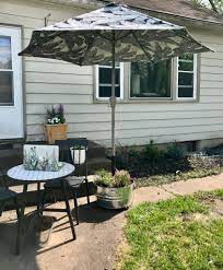 The patio umbrella base will be holding a huge umbrella so it needs to be strong. Diy Patio Umbrella Stand I Give No Sips