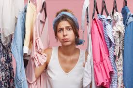See more ideas about clothing rack, rack, garment racks. Free Photo Depressed Female Standing Near Wardrobe Rack Full Of Clothes Having Difficult Choice Not Knowing What To Put On