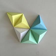 Around Two Years Ago While Exploring Design Blogs And Pinterest I Came Across A Picture Of Some Origami Wa Origami Wall Art Origami Shapes Geometric Origami