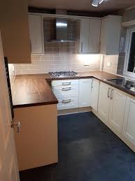 Walnut kitchen with lighting in the pelmet. Kitchen Worktop Replacement In Nottingham Alh Interiors Trustatrader