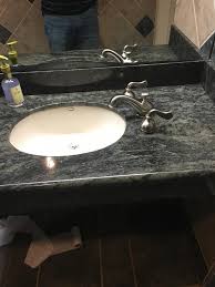sink handles and faucet located on the