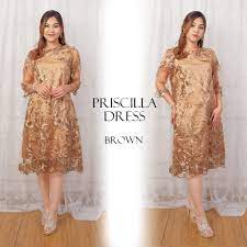Selain nuansa modern, model dress brokat juga memberikan tampilan yang klasik dan elegan dengan perpaduan antara busana tradisonal dan brokat modern. Model Gaun Brokat Mewah Pendek Gaya Ootd