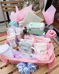 You can read stories from our tenth moon mamas to find out just how much they loved their postpartum care packages. Diy Postpartum Gift Basket For The New Mama She Comes To Life Diy Baby Shower Gifts Baby Girl Gift Baskets Mom Gift Basket