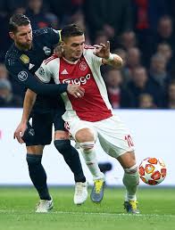 Dusan Tadic Of Ajax Competes For The Ball With Sergio Ramos Of Real Sergio Ramos Uefa Champions League Sports Images