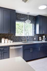 With Function In Mind This Midcentury Modern Kitchen Is Simple And Sleek Multicolor Pental Quartz Blue Kitchen Designs Kitchen Cabinet Design Modern Kitchen
