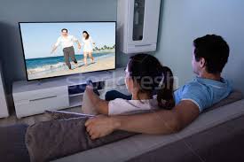 Tense man hugging worried woman covering mouth with hand while watching movie, blurred foreground. Couple Watching Movie Together Stock Photo C Andreypopov 7492492 Stockfresh