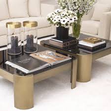 With a mirrored tabletop of bevelled black glass and a base of polished stainless steel, they will make a chic addition to your living room décor. Courrier Brass Coffee Table Eichholtz Fmdesign Elements