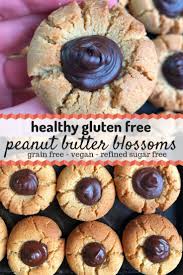 These Healthy Peanut Butter Blossoms Are A Healthier Take On The Original Cookie With A Hershey Kiss In The Middle Food Peanut Butter Blossoms Vegan Desserts