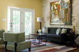 This dining room features a beige area rug with black writing and a light wood dining table paired with high back chairs. Area Rug Dos And Don Ts Austin Interior Design By Room Fu Knockout Interiors
