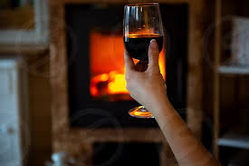 This stainless wine glass fits 14oz of wine and keeps it at its ideal temperature. Woman Hand Holding Wine Glass At The Fireplace By Zelma Brezinska Photo Stock Snapwire