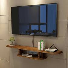 Fascinating parts of this wall mount layout are the wood dressed drifting shelf and the base closet. Solid Wood Wall Mounted Set Top Box Rack Living Room Wall Mounted Tv Cabinet Bedroom Simple Decorative Cabinet Aliexpress