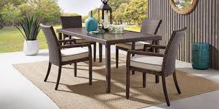 This collection includes one large dining table, four stationary dining chairs and two swivel rockers. Outdoor Patio Dining Furniture Wicker Wood Teak
